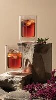 Stylish glasses with ice and drink photo