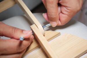 Crafting a wooden structure with precise hand tools photo