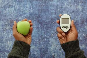 Comparing healthy food and glucose monitoring device photo