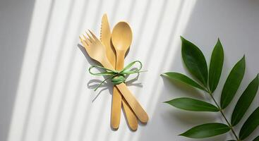 set of eco-friendly bamboo cutlery, a fork, knife, and spoon photo