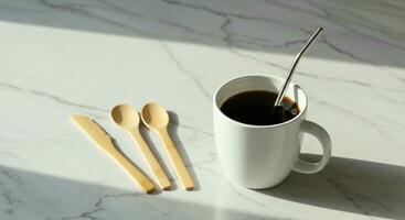 Eco friendly cutlery set Knife, Spoon and a glass of tea with straw photo