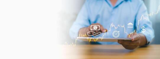 Person in blue shirt using tablet with digital stock market graph, financial icons, symbolizing online investment, digital banking, financial technology, and economic growth on white background. photo