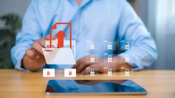 Secure data upload and cloud file sharing concept with businessman touching virtual folder icon photo