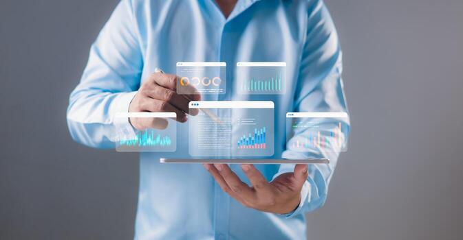 Businessman using a stylus to analyze interactive data dashboards on digital tablet screen. Data analytics, business intelligence, technology solutions, financial performance, Real-time visualization. photo