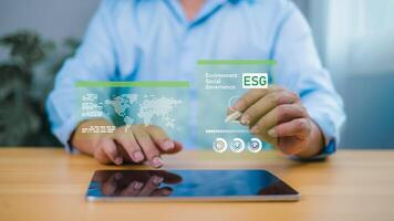 Person interacting with ESG holographic display for sustainable development and corporate responsibility photo