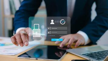Businessman using virtual login interface on digital device, cybersecurity, data protection, identity verification, and secure online access in modern business environment. photo