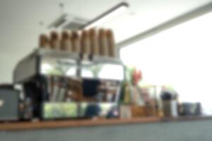 Blur the background of the coffee machine standing on a wooden countertop photo