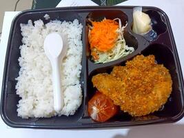 Bento Box Lunch with Crispy Fried Chicken, Rice, and Salad photo