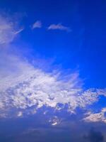 Vivid Blue Sky with Dramatic Cloud Formations and Soft Lighting photo