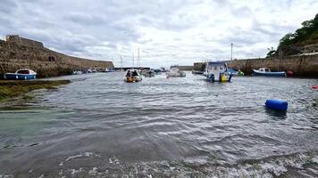 Boats moving through a port in Fife video