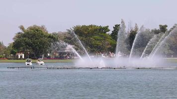 Fountain show in a scenic park setting video