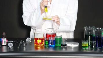 Scientist conducting experiment with liquids video