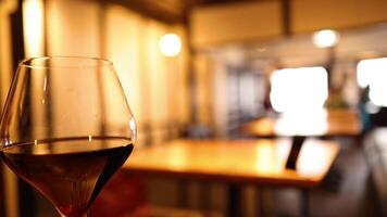 Close-up of wine glass in a cozy setting video
