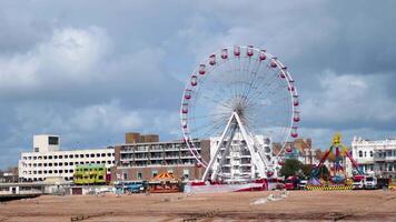 Ferris wheel and merry-go-round by the seaside video