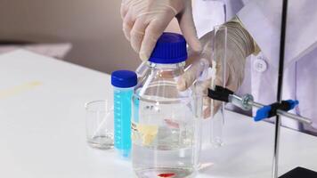 Scientist conducts NaOH reaction in laboratory setting video
