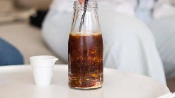 Sequence of pouring coffee from bottle to cup video
