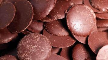 Close-up view of chocolate discs being moved video