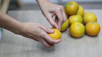 Sequential frames of peeling an orange video