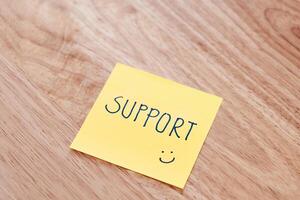 Supportive note yellow sticky pad office desk indoor close-up encouragement photo