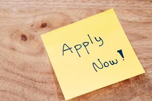 Job application reminder note office desk digital content professional environment close-up view motivation photo