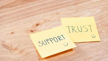 Motivational sticky notes for office support and trust messages for a professional environment photo