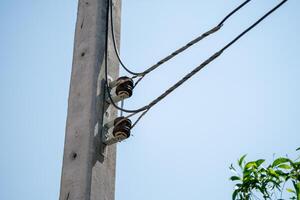 Electrical utility pole close-up urban area clear sky high angle infrastructure concept photo