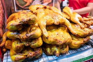 Grilled chicken feast at local market street food vibrant atmosphere culinary delight photo