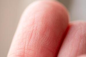 Close-up of a human finger indoor setting macro soft lighting detailed texture exploration photo