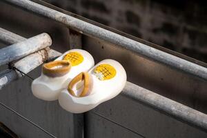 Abandoned children's clogs industrial setting urban environment close-up perspective photo