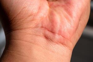 Analyzing skin texture and health close-up view of palm indoor setting personal care photo