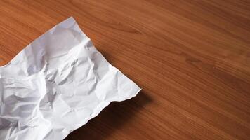 Crumpled paper action desk setting still life minimalist environment close-up view creative concept photo