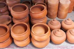Traditional pottery crafting event artisan workshop clay pots indoor studio close-up view cultural heritage photo