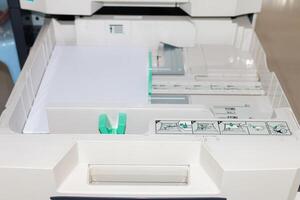 Office printer maintenance routine office space how-to guide indoor setting close-up view efficiency tips photo