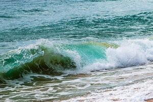 Waves crashing shore beach nature coastal environment close-up view serenity concept photo