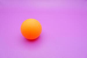 Ping Pong Ball on a Pinkish Purple Background photo