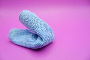 Blue Microfiber Cleaning Cloth on Pink Background photo