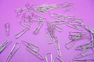 Cluster of Metal Triangle Paper Clips for Documents photo