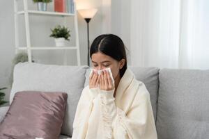 Woman wrapped in a blanket feeling unwell photo
