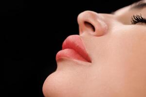 Focus on lips with refined shape and pigmentation after expert permanent makeup. photo