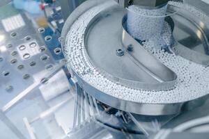 Automated Tablet Production Line in Pharmaceutical Factory with High Volume Packaging Process photo