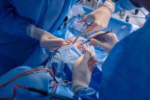 Surgeons performing a surgical procedure photo