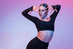 Latin Female Dancer Portrait in Studio with Expressive Hand Pose Modern Fashion Dance Close Up photo