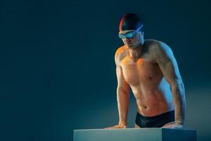 Swimmer ready to dive in photo