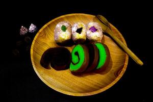 A wooden plate with a plate of food on it photo