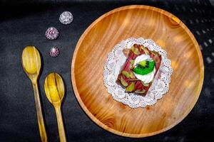 A plate with a dessert on it and a spoon photo
