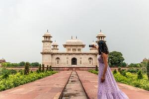 Tourist taking selfie in front of Itmad-Ud-Daulah's Tomb in Agra, India photo