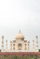 Taj Mahal standing majestically on the banks of Yamuna River in Agra photo