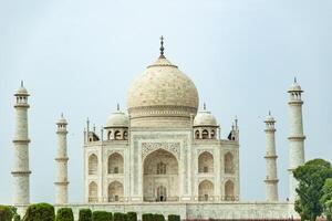 Taj Mahal standing majestically under cloudy sky in Agra photo