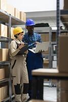 Diverse employees team in safety gear perform shipment tasks in the depot, managing bar code scanning and supply chain inventory products on shelving units. Logistics center operations. photo