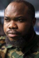 Focus on military operative deploying electronic warfare tools to disrupt enemy communication systems. African american soldier operating on high tech infrastructure, close up photo